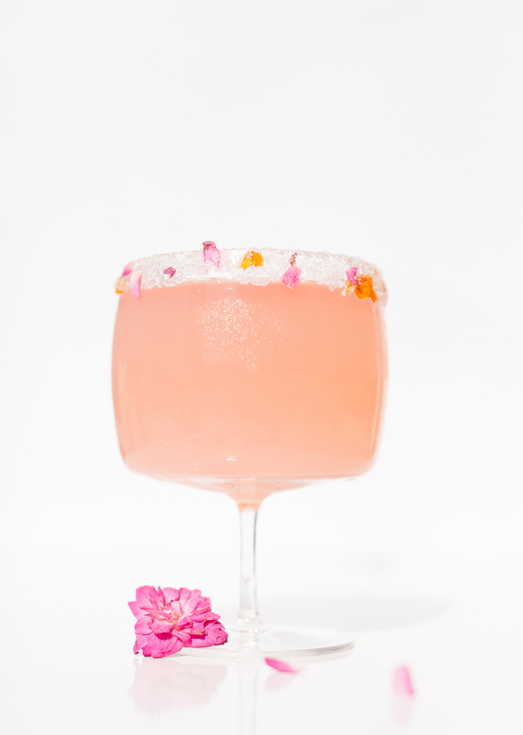 A Kiss Is Not A Contract cocktail with edible flower sugar rim // get the recipe on craftandcocktails.co