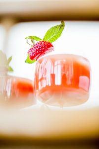 An aqauvit cocktail thats summer ready with watermelon and ripe strawberries.