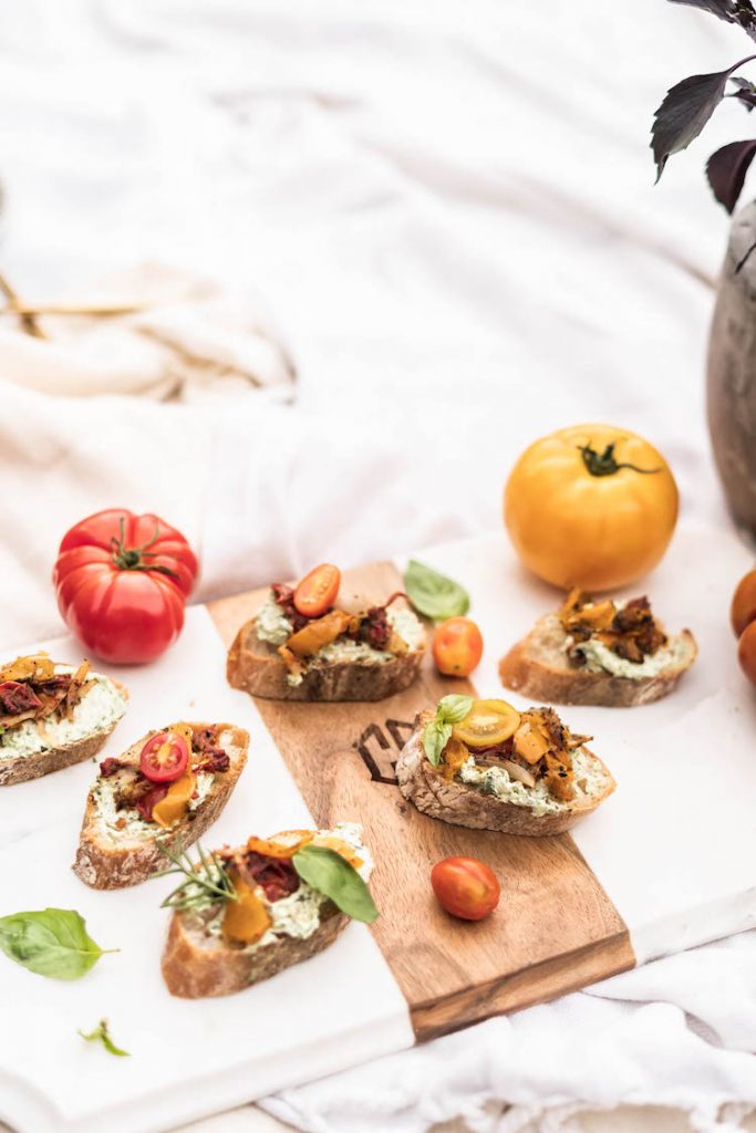 Tomato Pepper Toasts with Whipped Basil Goat Cheese